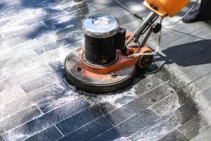 worker cleaning floor